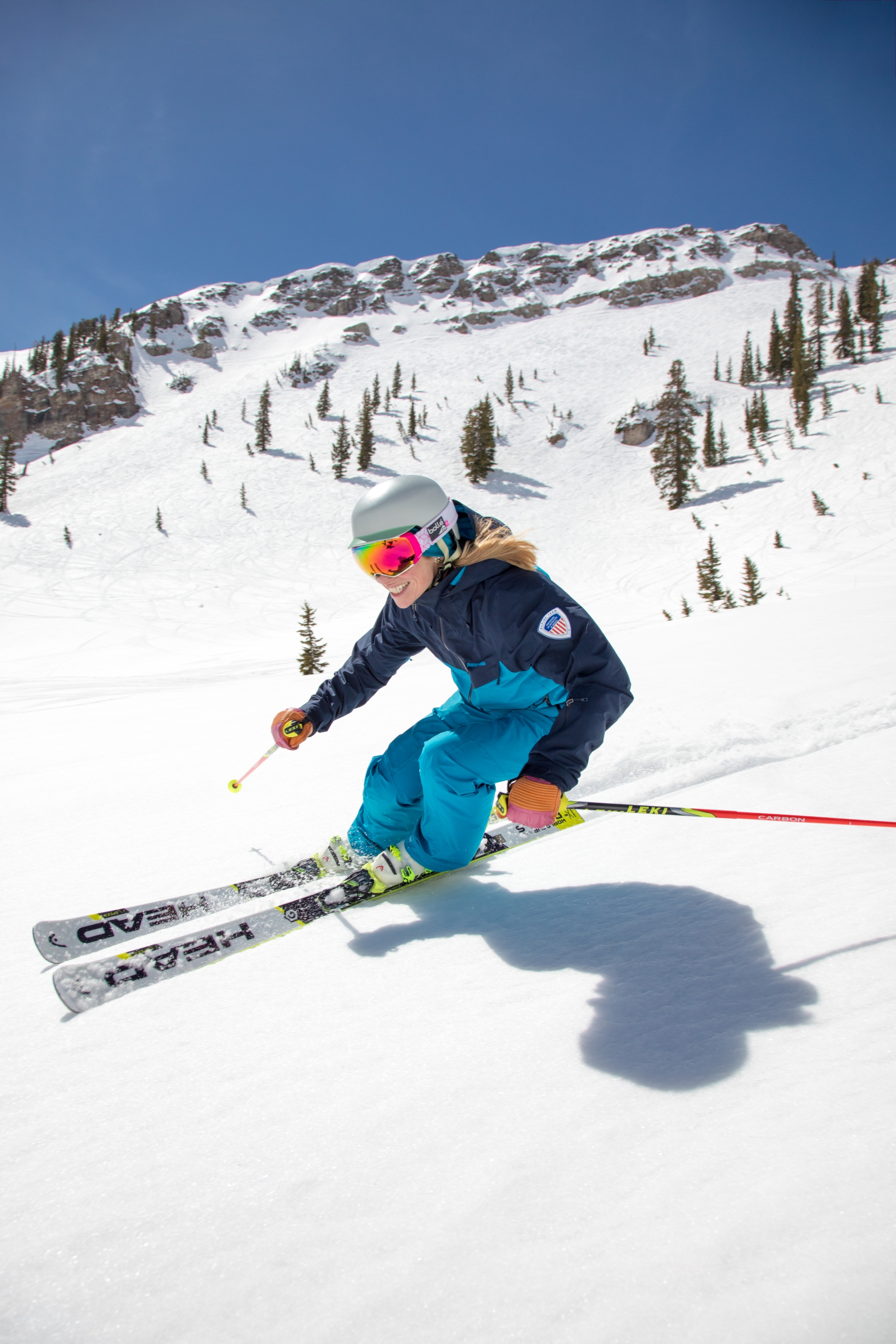 PSIA Alpine Team member Robin Barnes carves on her skis down a slope