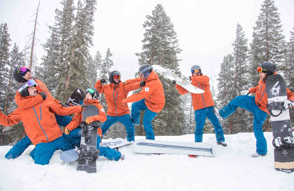 The AASI Snowboard team fake fights for the photographer