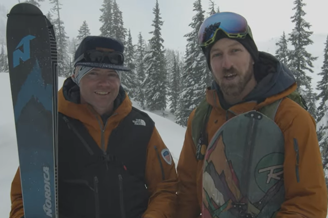 An uphill skier and a splitboard snowboarder