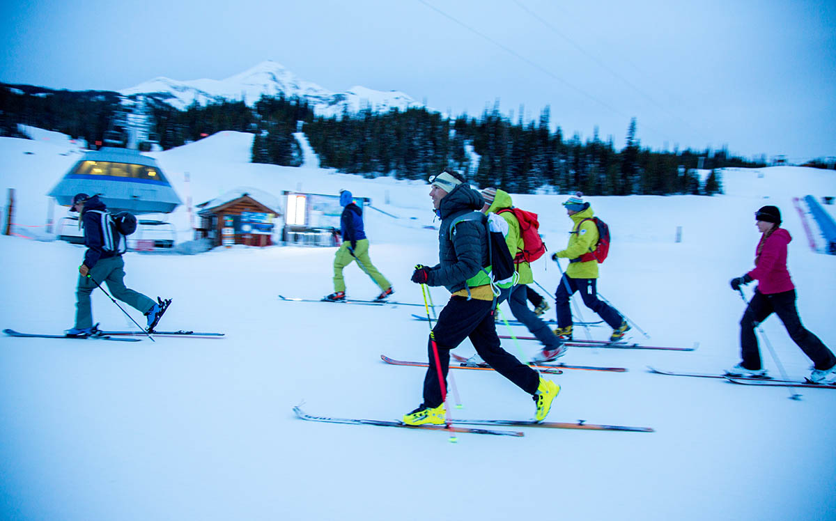 skiers skin uphill at big sky in montana